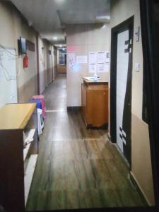 an empty hallway in an office with a desk at Sri Krishnaa comforts in Bangalore