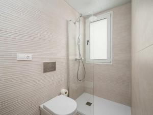 a bathroom with a shower and a toilet and a window at Luxury 2 Bedrooms Apartment Bayview Hills Nerja in Torrox +18 photos