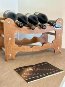a wooden knife holder with a bunch of knives at Da Nonna Laura in Follina
