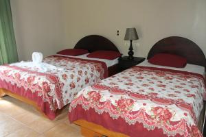 Llit o llits en una habitació de Hotel Vista al Tortuguero