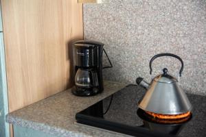 a coffee maker sitting on top of a counter at Appartamenti Bonaventura in Tignale