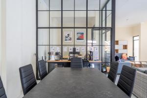 a conference room with a table and chairs at Spacious Tropical Villa with Pool and Bfast in Sleman +131 photos