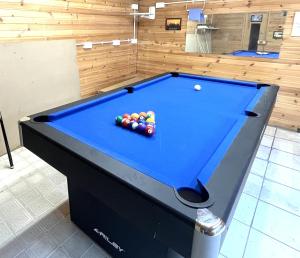 a pool table with balls on it in a room at Stag and Barrel in Elgin