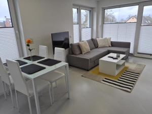 a living room with a couch and a table at Wohnung in Dahme