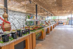 a buffet line with many plates of food at Golden Sun Hotel Adult Only in Beldibi