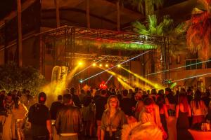 a crowd of people walking on a stage at night at Golden Sun Hotel Adult Only in Beldibi
