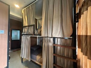 a couple of bunk beds in a room at Beyond Nomad Luxury Hostel in Ella