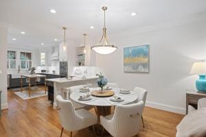 a kitchen and living room with a table and chairs at 3026 Fairway One in Seabrook Island