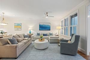 a living room with a couch and a table and chairs at 3026 Fairway One in Seabrook Island