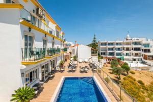 an aerial view of a building with a swimming pool at Vila Sao Vicente Boutique (Adults Only) in Albufeira