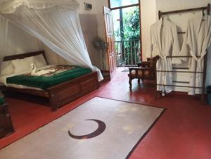a bedroom with a bed with a crescentresent at Rock View Rest Hatton in Hatton