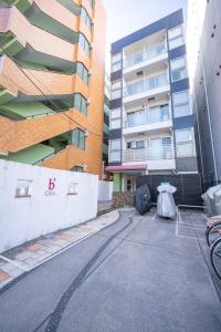 an empty street in front of a building at BK Residence Kawasaki in Kawasaki