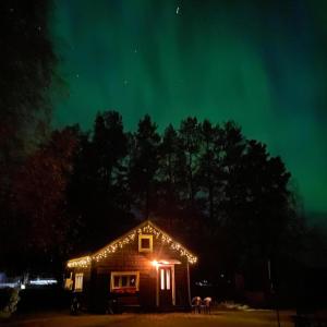 a house with christmas lights on it at night at Villa Ragunda in Hammarstrand