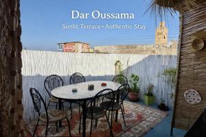a table and chairs sitting on a patio at Dar Oussama in Rabat +45 photos