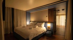 a bedroom with a large bed in a room at Marina Suite in Loano