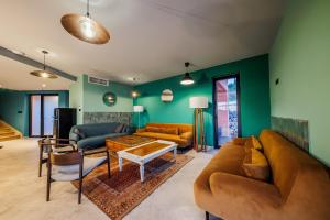 a living room with a couch and a table at Villa sea, sun and fun in Trogir
