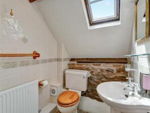a bathroom with a toilet and a sink at Horner- Ukc4923 in Timberscombe