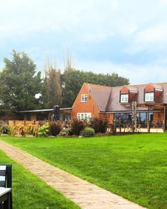 a house with a green lawn in front of it at The Crescent Turner Hotel in Whitstable
