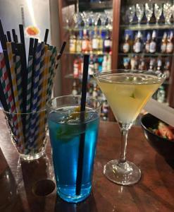 two cocktails sitting on a table in a bar at Gospoda Rycerska pod Grunwaldem in Grunwald