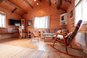 a living room with a couch and a table at Valen Cabins in Reine in Reine