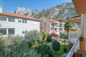 a view from the balcony of a building with mountains in the background at World Traveler Nest in Kotor