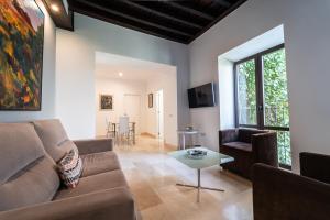 a living room with a couch and a table at GAV Santa Pola in Ronda
