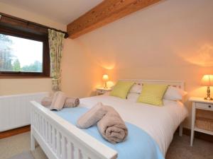 a bedroom with a white bed and a window at 2 Bed in Matlock oc-75893 in Smalley