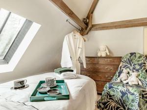 a bedroom with a bed with a tray on it at 2 Bed in Ashbourne oc-89339 in Edwalton +21 photos