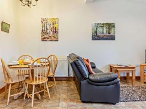 a living room with a couch and a table at 2 Bed in Ellesmere oc-94418 in Dodleston