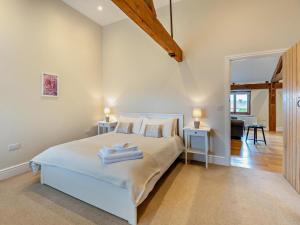 a bedroom with a bed with towels on it at 1 Bed in Bucknell oc-94662 in Letton