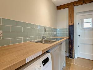a kitchen with a sink and a counter top at 1 Bed in Bucknell oc-94661 in Letton +30 photos