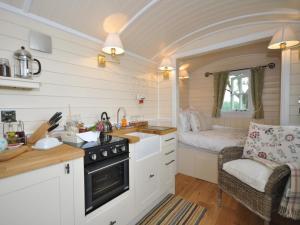 a kitchen with a sink and a stove in a room at 1 Bed in Hereford oc-44235 in Longtown