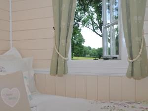 a bedroom with a bed and a window at 1 Bed in Hereford oc-44235 in Longtown