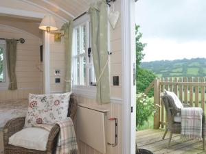 a room with a porch with a chair and a balcony at 1 Bed in Hereford oc-44235 in Longtown