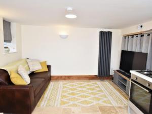 a living room with a couch and a tv at 1 Bed in Hereford oc-87736 in Moccas