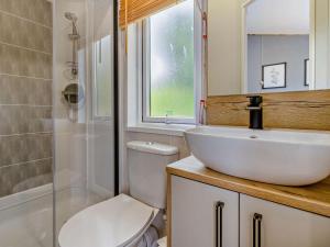 a bathroom with a sink and a toilet and a shower at 3 Bed in Shrewsbury oc-94112 in Bromlow +11 photos