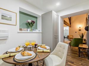 a dining room with a table with food on it at 2 Bed in High Peak oc-94058 in New Mills