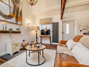 a living room with a couch and a table at 2 Bed in High Peak oc-94059 in New Mills