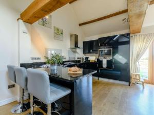 a kitchen with a large island in a room at 2 Bed in Evesham oc-89305 in Church Lench +11 photos