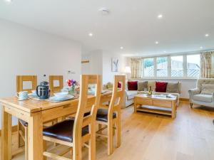 a kitchen and living room with a table and chairs at 2 Bed in Bristol oc-72582 in Winford