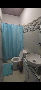 a bathroom with a sink and a toilet and a shower at GK Luxury Stay in Cruce de Veragua