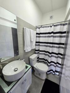 a bathroom with a sink and a toilet and a shower at GK Luxury Stay in Cruce de Veragua