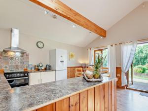 a kitchen with a counter top and a stove top oven at 2 Bed in Ledbury oc-77377 in Yatton