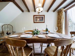 a dining room with a wooden table and chairs at 3 Bed in Hope Valley oc-pk432 in Aston +7 photos