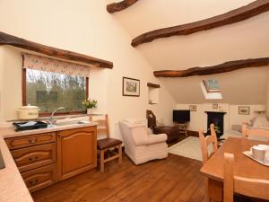 a kitchen and living room with a table and chairs at 2 Bed in Hope Valley oc-pk431 in Aston