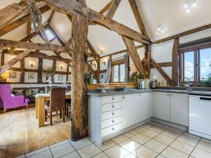 an open kitchen with wooden ceilings and a dining room at 4 Bed in Ludlow oc-chl22 in Orleton