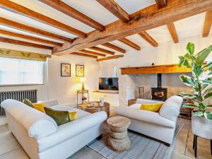 a living room with two couches and a fireplace at 3 Bed in Warwick oc-93887 in Kineton