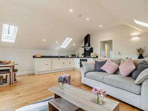 a living room with a couch and a table at 1 Bed in Bakewell oc-91367 in Youlgreave