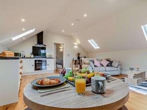 a living room with a table with food on it at 1 Bed in Bakewell oc-91367 in Youlgreave
