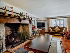 a living room with a fireplace and a couch at 8 Bed in Bristol oc-87469 in Winterbourne